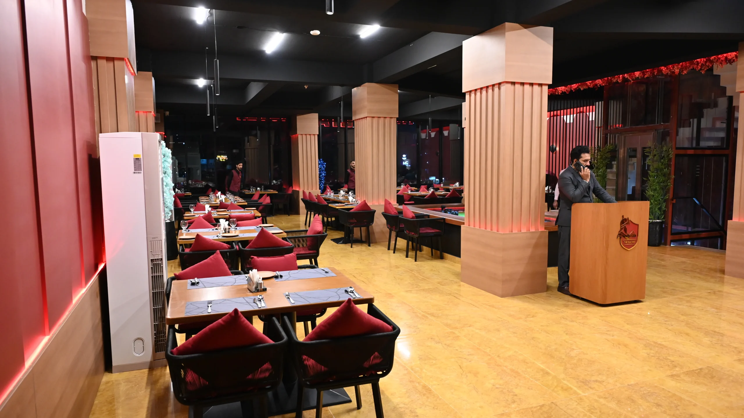 Spacious indoor dining area at a premier restaurant near Islamabad Airport with comfortable seating.